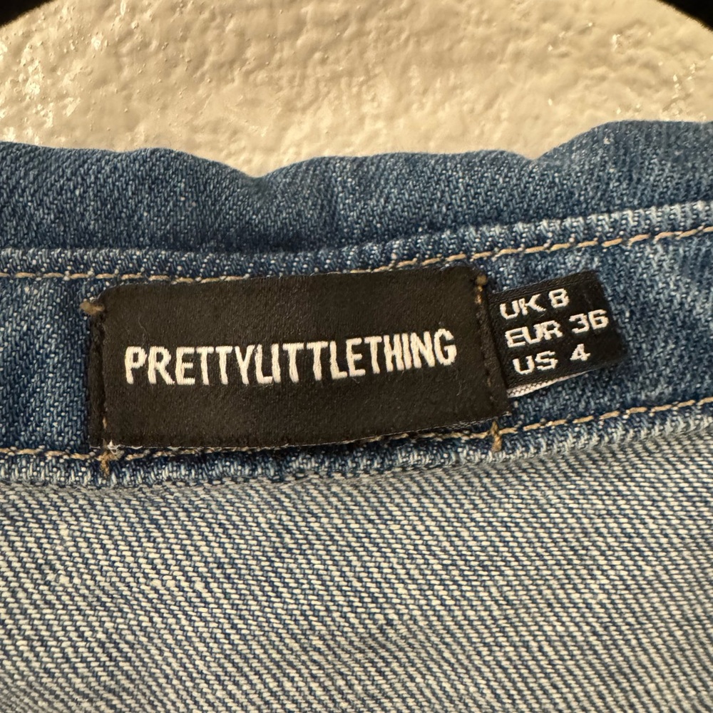 Denim button down shirt. Size 4 but fits oversized. Great quality- barely worn
